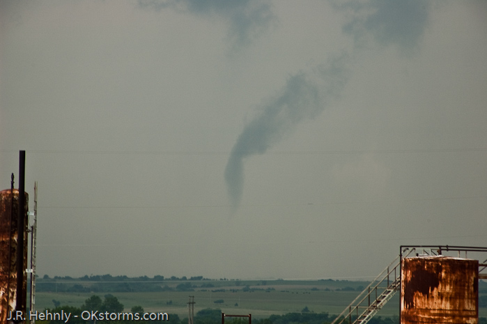 Simultaneous tornadoes continue on the ground for several minutes near Orlando, OK.