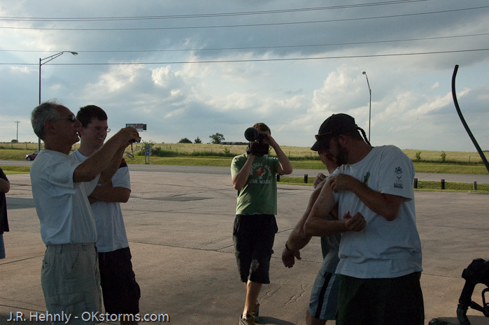 Shane Adams and Chad Lawson show their tornado tattoos off to Howie.