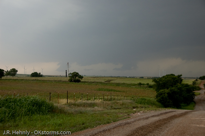 Looking west at numerous lowerings and scud clouds