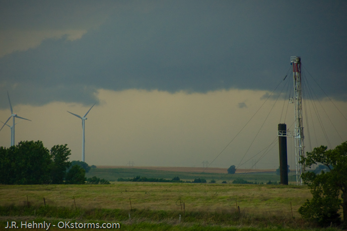 Looking west at numerous lowerings and scud clouds