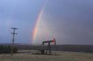 17:19:46 - Rainbow behind an oil pump.