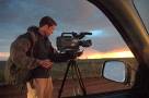 HWY 44, 10 miles west-southwest of Cordell, OK - Keith Cavey films the sun setting through the rain.
