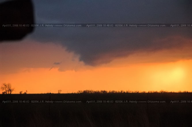 April 1, 2006 - Shamrock, Texas and Western Oklahoma HWY 44, 10 miles west-southwest of Cordell, OK - Sun setting through the rain.
 - 20060401_184803.jpg