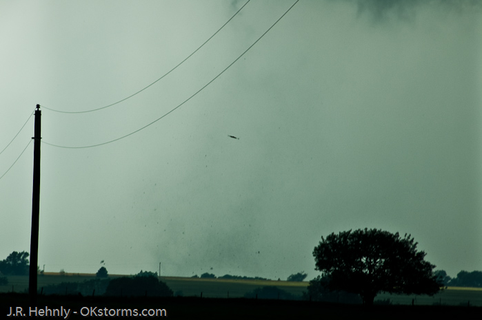 Though the condensation funnel didn't always reach the ground, a debris cloud was visible indicating damage was being done.