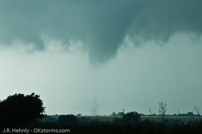 Though the condensation funnel didn't always reach the ground, a debris cloud was visible indicating damage was being done.