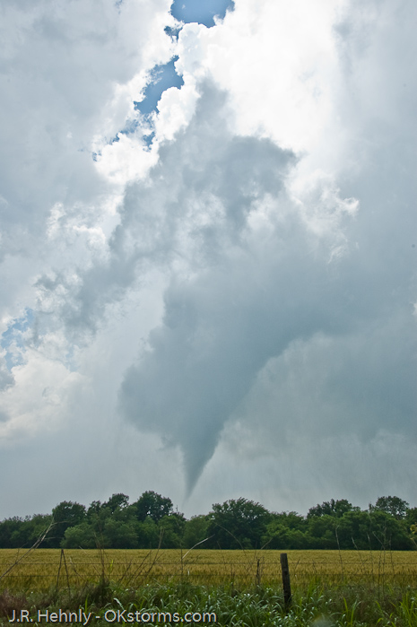 Clear sky seen behind the updraft and tornado.