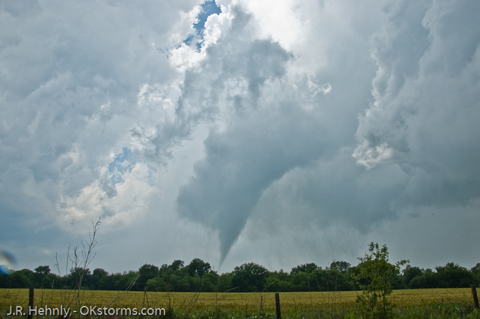 Clear sky seen behind the updraft and tornado.