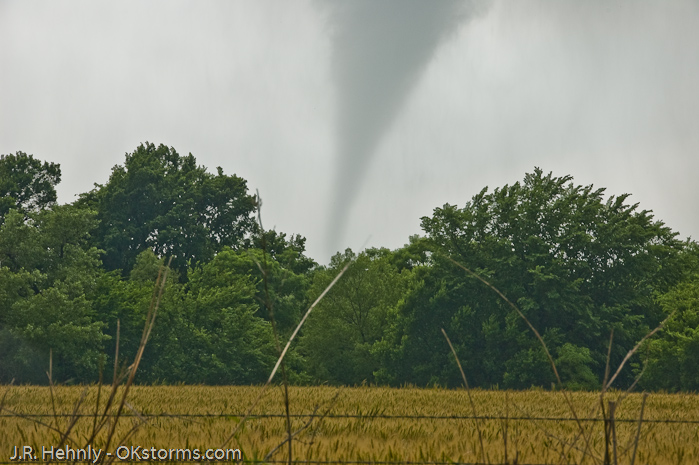 Tornado west of Bison, OK ramains on the ground for several minutes.
