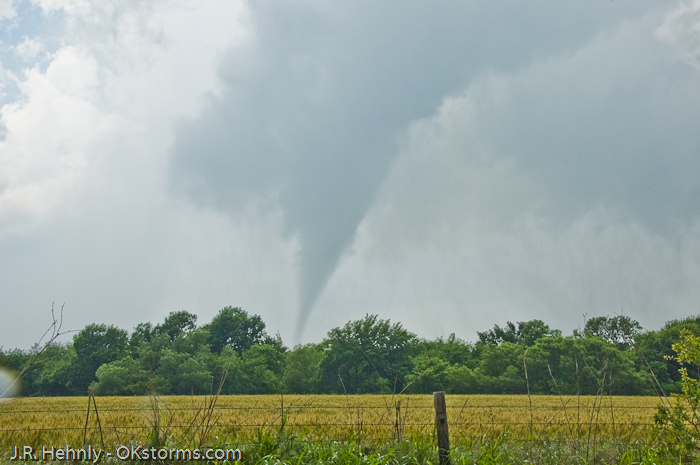Tornado west of Bison, OK ramains on the ground for several minutes.