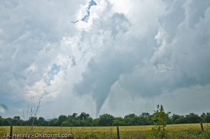Tornado west of Bison, OK ramains on the ground for several minutes.