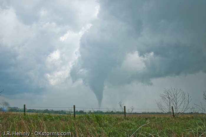 Tornado west of Bison, OK ramains on the ground for several minutes.