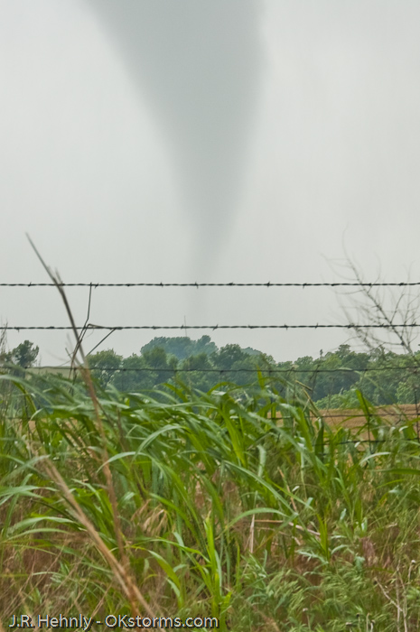 Tornado west of Bison, OK ramains on the ground for several minutes.