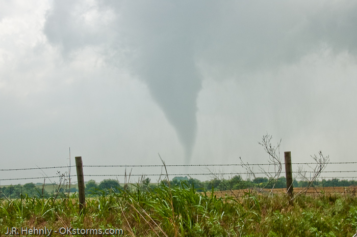 Tornado west of Bison, OK ramains on the ground for several minutes.