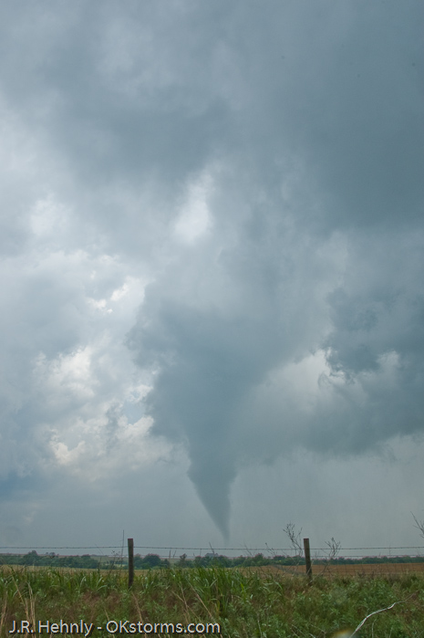 Tornado west of Bison, OK ramains on the ground for several minutes.