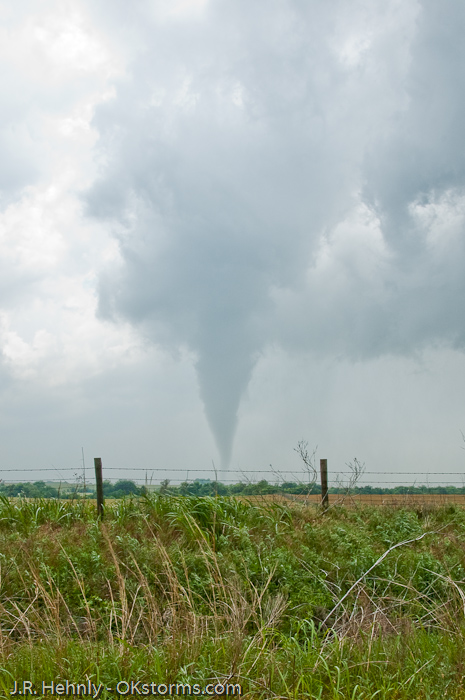 Tornado west of Bison, OK ramains on the ground for several minutes.