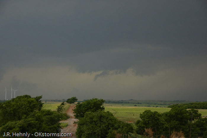 Looking west at numerous lowerings and scud clouds