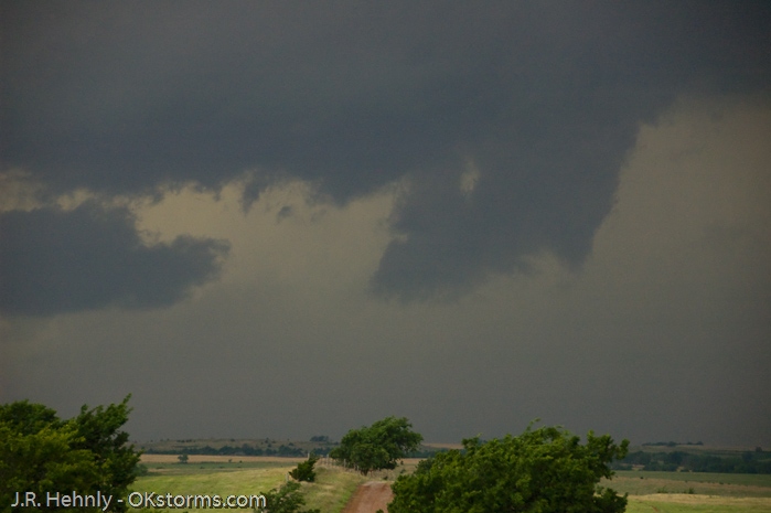 Looking west at numerous lowerings and scud clouds