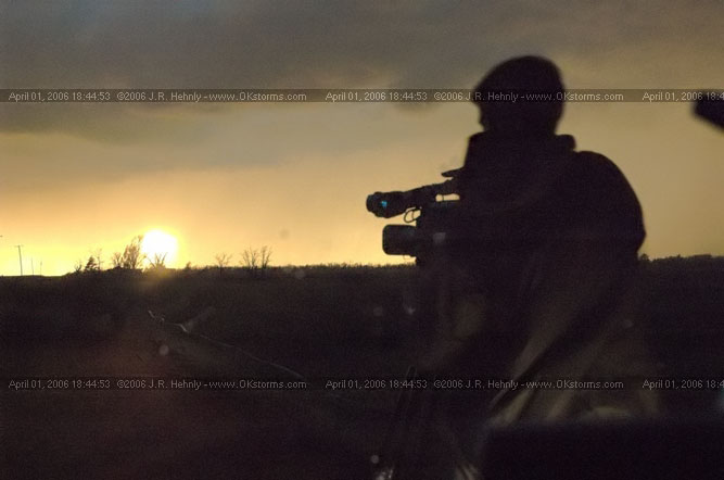 April 1, 2006 - Shamrock, Texas and Western Oklahoma HWY 44, 10 miles west-southwest of Cordell, OK - Keith Cavey films the sun setting through the rain.
 - 20060401_184453.jpg