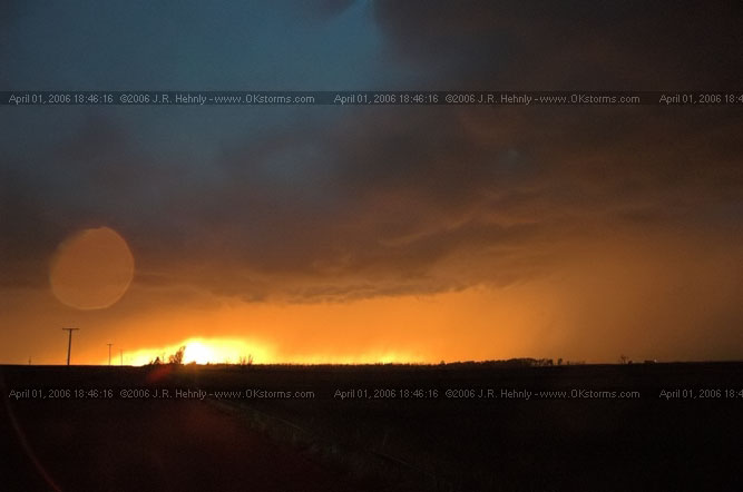 April 1, 2006 - Shamrock, Texas and Western Oklahoma HWY 44, 10 miles west-southwest of Cordell, OK - Sun setting through the rain.
 - 20060401_184616.jpg