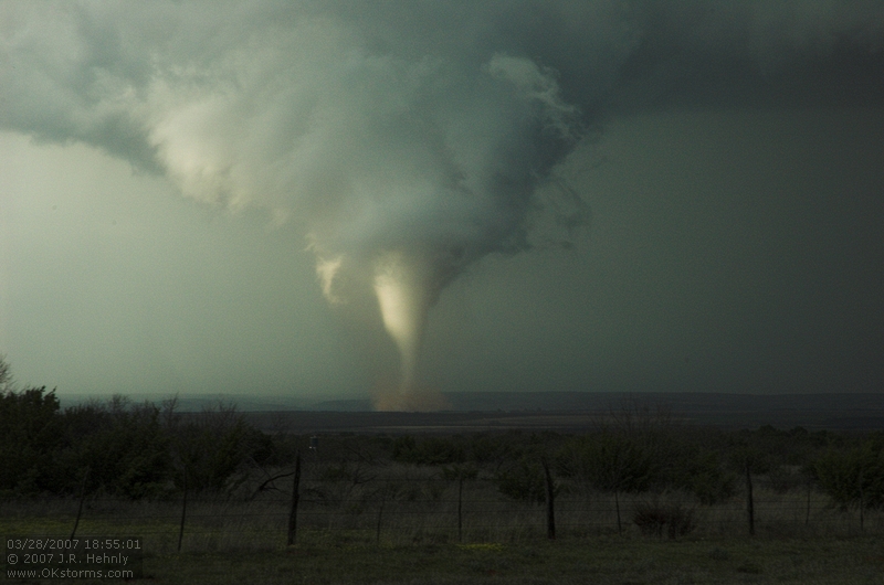 The southern storm produces a very nice tornado as it crosses over the Caprock Canyon State Park. One of the best scenes was when the side was illuminated by the sun the tornado crossed the Red River and threw up a spray of red water.