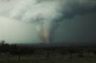 The southern storm produces a very nice tornado as it crosses over the Caprock Canyon State Park. One of the best scenes was when the side was illuminated by the sun the tornado crossed the Red River and threw up a spray of red water.